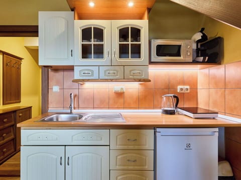 Cabinetry, Kitchen, Kitchen Appliance, Countertop, Wood, Furniture, Major Appliance, Plumbing Fixture, Interior Design, Sink