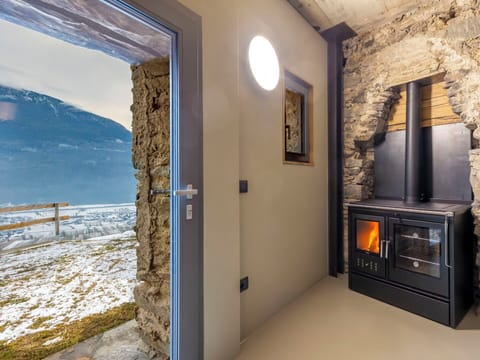 Interior Design, Furniture, Hearth, Home Appliance, Wood-Burning Stove, Living Room, Wood Stain, Hardwood, Wood Flooring, Fireplace