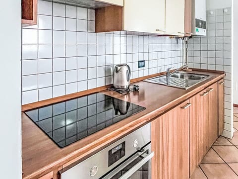 Interior Design, Plumbing Fixture, Kitchen, Flooring, Countertop, Kitchen Sink, Major Appliance, Tap, Floor, Plumbing