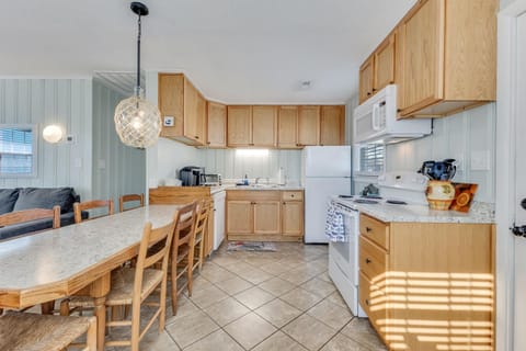 Your spacious kitchen features granite counters, full-size appliances, and a dining area perfect for family meals together.