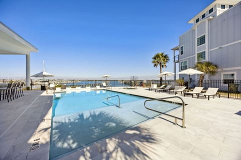 Enjoy pristine poolside living from the comfort of your private retreat