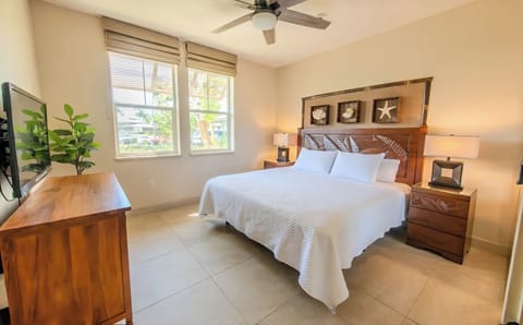 Recharge in a serene king bedroom with warm, hotel-style linens.