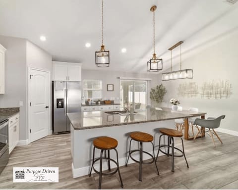 Whether you're preparing family meals or enjoying morning coffee, this beautifully designed kitchen offers comfort, convenience, and style at every turn.