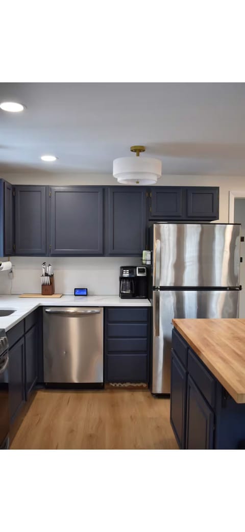 Spacious kitchen with new appliances and cabinets for optimal storage