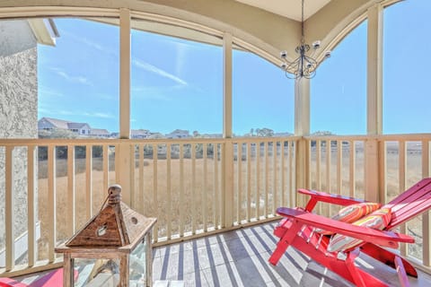 Relax in your private sunroom and watch blue herons glide over the serene marsh views.