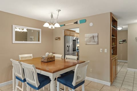 Modern dining for six with a view of the kitchen.