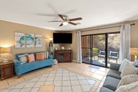 Relax in your sun-drenched coastal retreat—just steps away from your private patio.