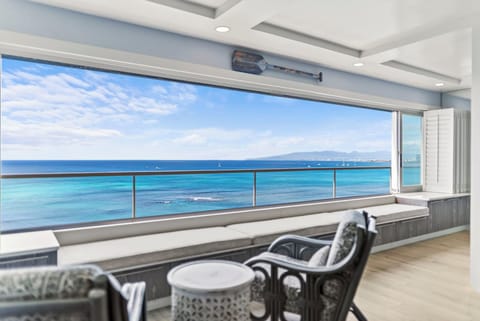 Unwind in your private oceanfront retreat with breathtaking sea views through open panoramic windows.