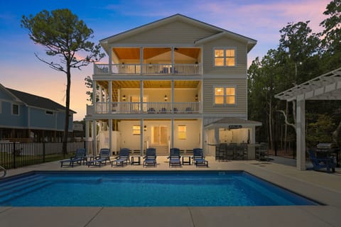 CC136: Breezy Does It | Back Exterior with Pool, Hot Tub and Tiki Bar
