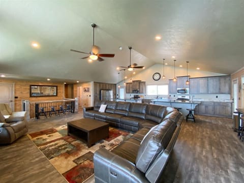 Spacious open-concept living with cozy seating and a kitchen perfect for gathering and entertaining.