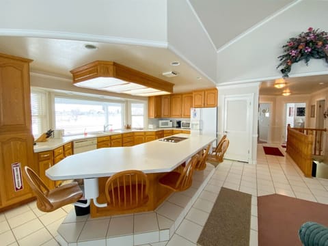 Spacious kitchen with panoramic views and ample seating—perfect for cooking, dining, and making memories