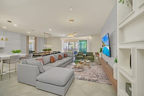 Bright, open living area w/ large sectional & big-screen TV for movie nights in.
