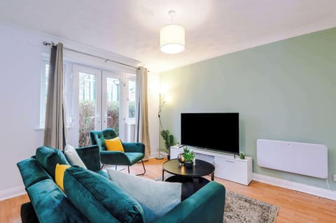 Living Room: Chill out in a vibrant space with plush seating and garden views!