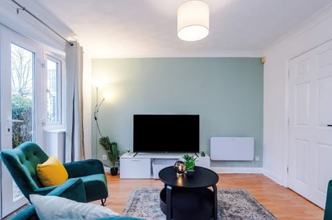 Living Room: Bright and airy space with chic decor, perfect for unwinding or catching up on shows!