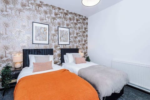 Bright Twin Room: Vibrant decor and plush beds create the perfect retreat for your getaway!