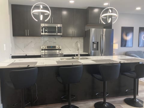 4 Counter high chairs serves as dinning space.