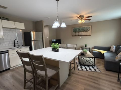 Open layout keeps the family connected — kitchen, dining, and living as one