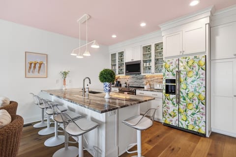 Fully equipped kitchen with island seating and standout design details.
