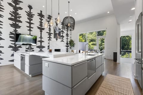 Modern kitchen with high-end appliances and sleek countertops.