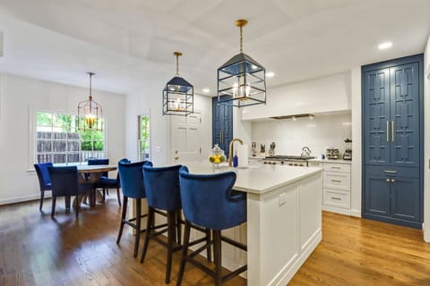 Spacious kitchen with sleek countertops and modern design touches.