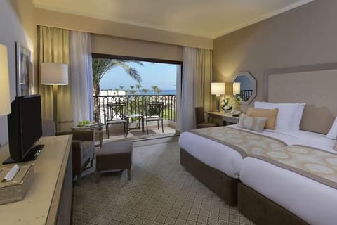Breathe in sea air from bed with balcony views.
