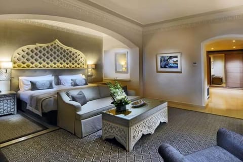 Sink into crisp linens beneath an elegant statement headboard.