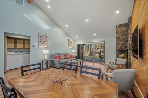 Relax in this bright, modern living space with stylish furnishings, cozy fireplace, and kitchen nearby for your convenience.