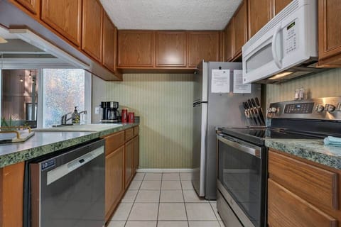 Full kitchen with all home's necessities. Microwave, Range/Oven, Dishwasher and Fridge.