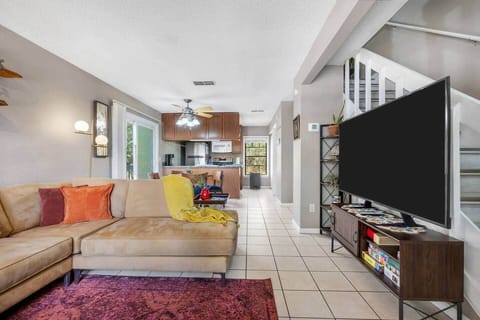 Pictured is the full length of the room.  The room has many sources of natural light.