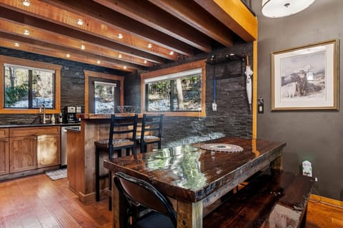 Your rustic mountain kitchen features exposed beams and natural stone, creating a cozy atmosphere for memorable meals together.