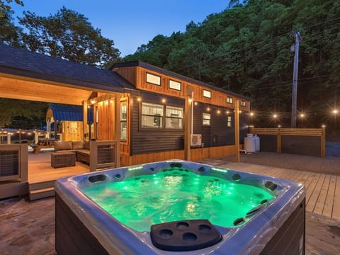 Outdoor Oasis: Immerse yourself in relaxation with a glowing hot tub and enchanting nature views!