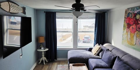 65 inch TV, large couch with view of Sunsets over Currituck Sound