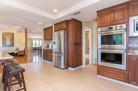 Spacious fully stocked kitchen with top of the line appliances to prepare all the favorite family recipes. 