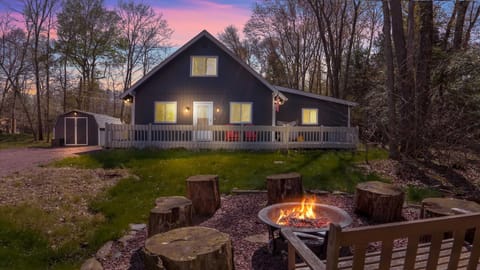 Modern Mountain Cabin Exterior with Fire Pit & Evening Lighting