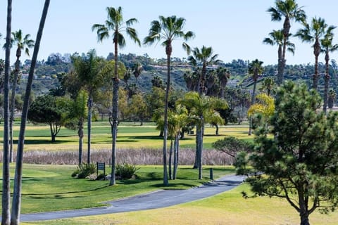 Unwind with long-distance views over palms and rolling hills.