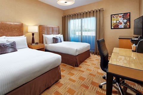 Relax together in a bright double-bed room with cozy finishes.