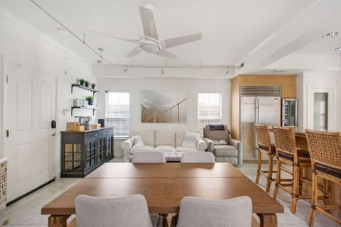 Living room attached to the kitchen with a Smart TV (log in to your own streaming apps) and dining table seating for four.