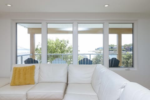 Perfect blend of simplicity and serenity, with wide windows showcasing the sea