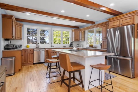 Bright kitchen with modern appliances and breakfast bar.