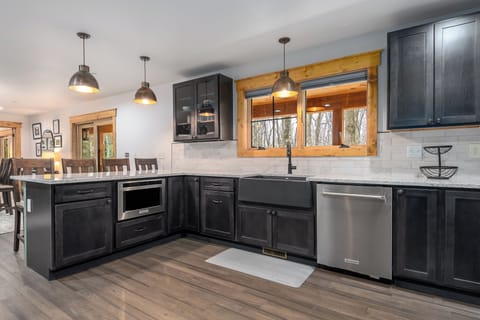 Under the counter Microwave and 4 bar stools