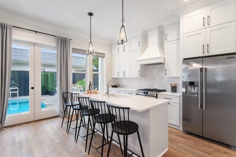 Kitchen | Fully Equipped Chef’s Kitchen | Main Level | Central Common Area