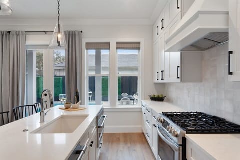 Kitchen | Fully Equipped Chef’s Kitchen | Main Level | Central Common Area