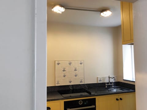 Well equipped, galley style kitchen | The Anchorage, Staithes, near Whitby