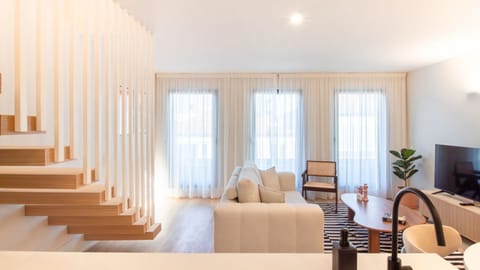 Elegant living room with full-length windows, custom staircase, and minimalist design—perfectly balancing light, comfort, and style.
#DesignerDuplex #NaturalLight #StylishInteriors #PortoLiving