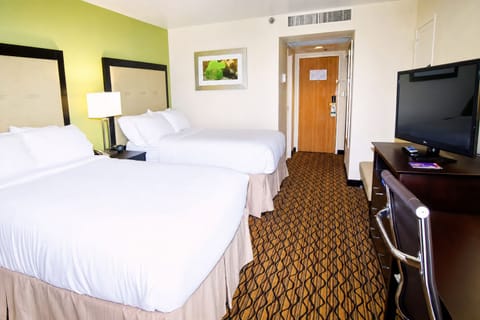 Stretch out in a bright room with two cloud-soft beds.