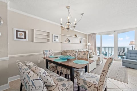 Oceanfront dining area with comfortable seating, perfect for enjoying meals while taking in breathtaking views of the Atlantic just beyond the windows.