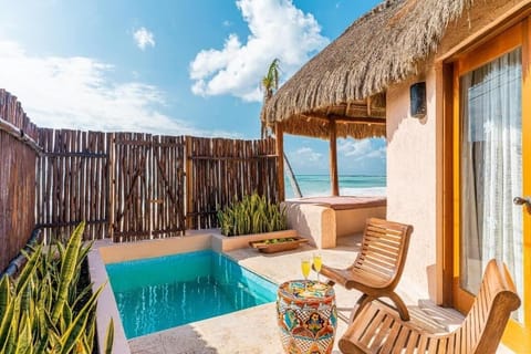Dip into your private plunge pool under warm coastal sun.