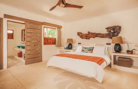 Unwind in a serene king suite with warm wood accents.