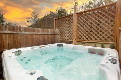 Relax on the back deck with a private 4-seat hot tub and outdoor dining area.