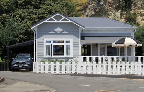 Street view with parking up driveway and free street parking. 